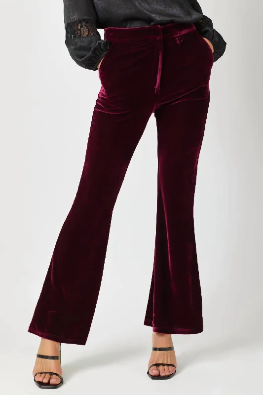 Tight-fitting trousers for men with stretchable material for flexibility and comfort -Velvet Flare Trousers In Merlot