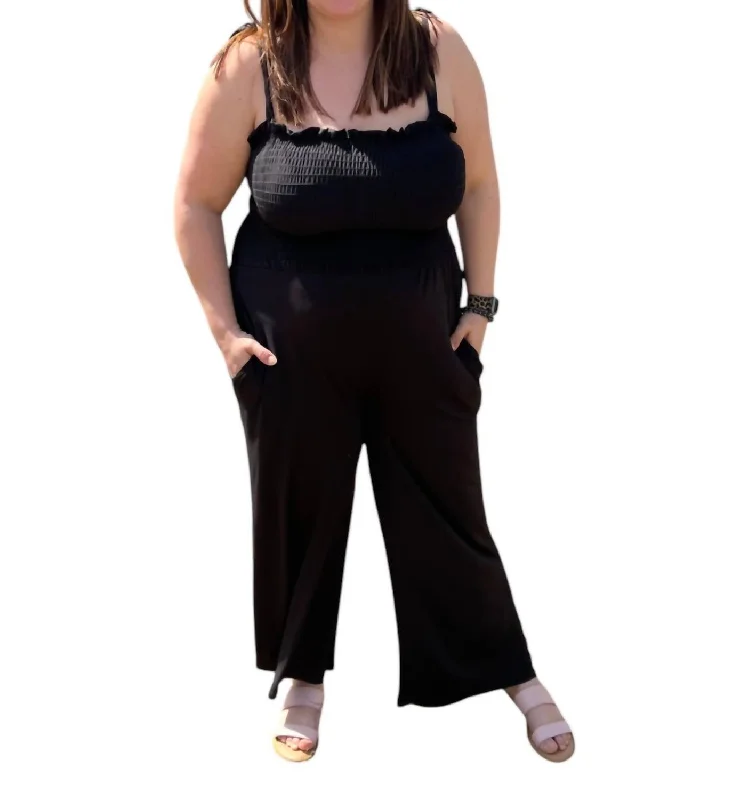 Classic tight trousers for women with smooth fabric and chic, timeless design -Smocked Jumpsuit In Black