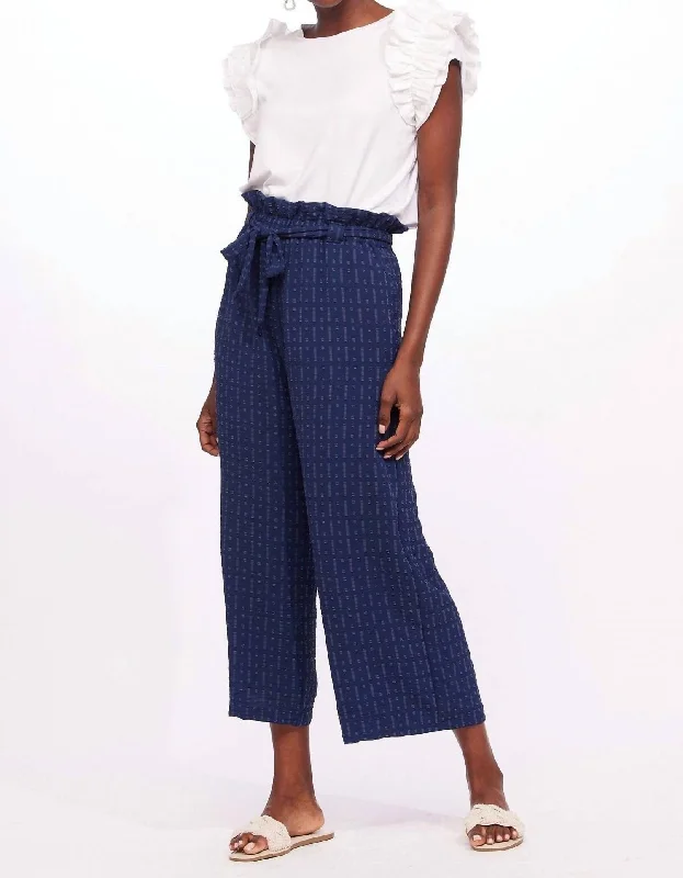 Tight trousers for men with zip fly and flat-front design for a polished look -Adalyn Cropped Pants In Indigo