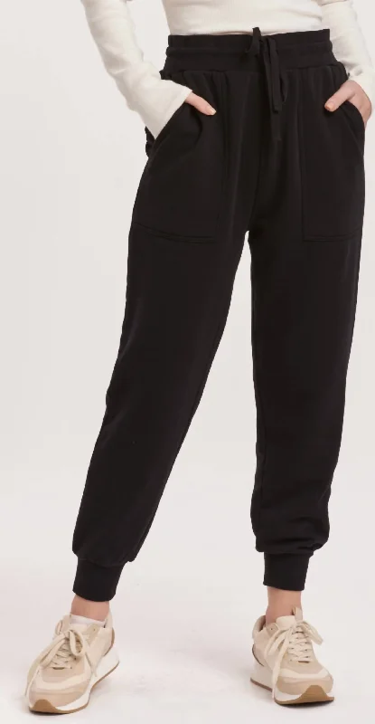 Tight trousers for women with side slits and ankle-length design for chic style -Dahlia Joggers In Black