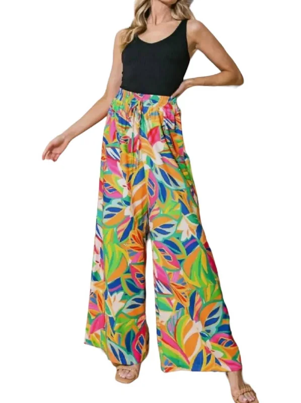 Tailored stretch tight trousers for women with comfortable waistband and flattering design -Tropical Patterned Flowy Pants In Tangerine Abstract